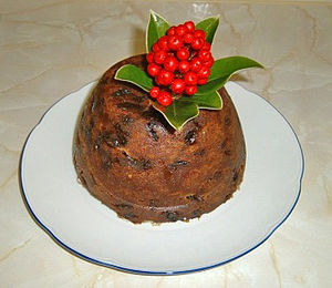 Christmas pudding decorated with skimmia rathe...