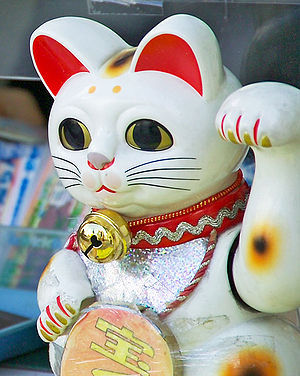 This maneki neko beckons customers to purchase...